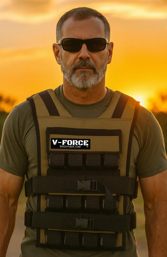Man standing in the sunset with a tan long weighted vest