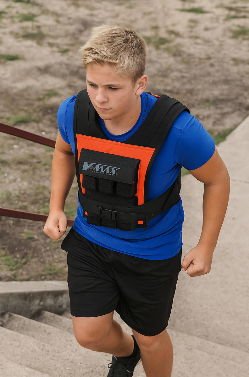 Youth athlete wearing 30 lb. V-Max Compact Weight Vest in orange, training for sports with padded comfort and adjustable 2.5 lb. weights